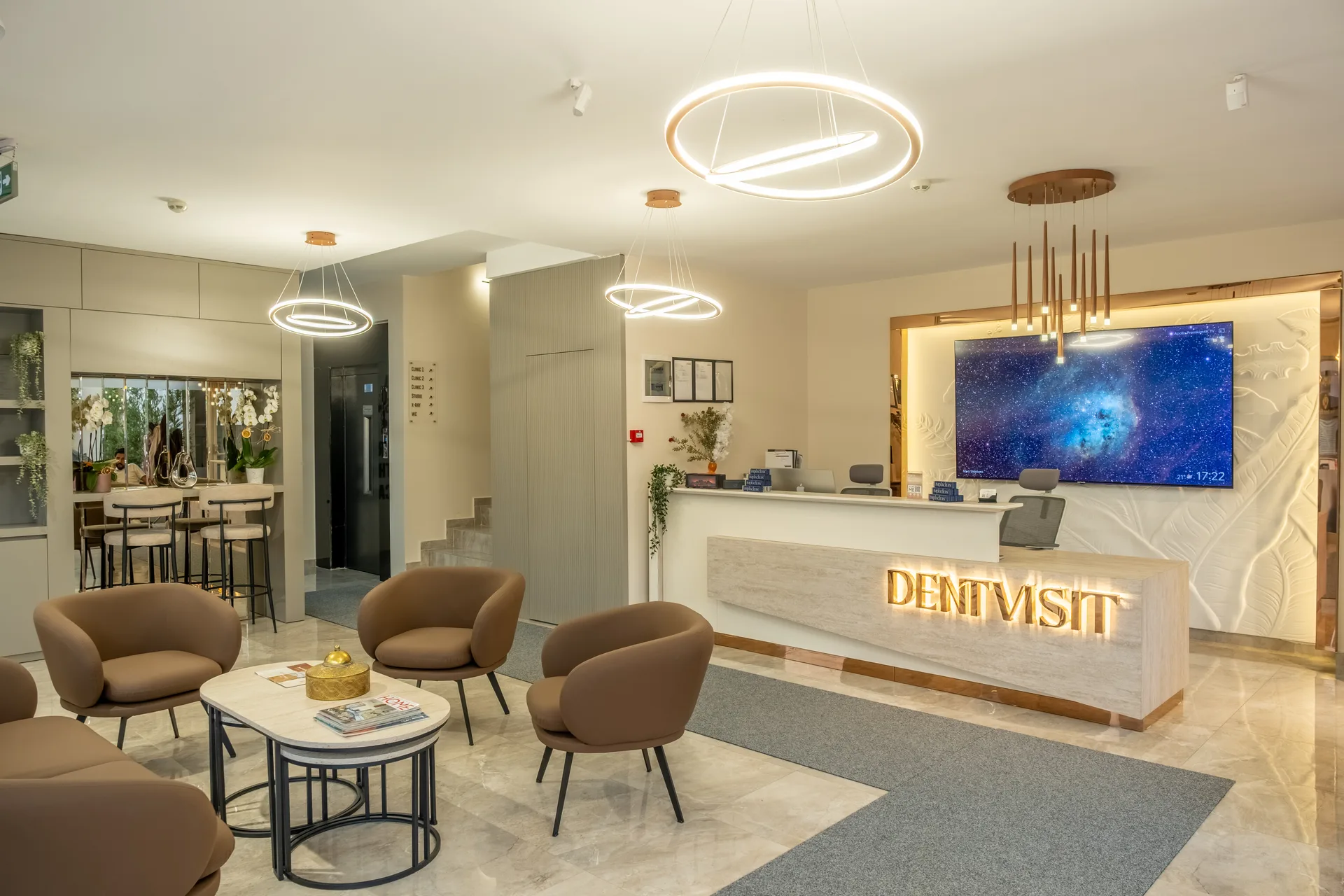 DentVisit waiting area with seating, the reception desk and the clinic sign